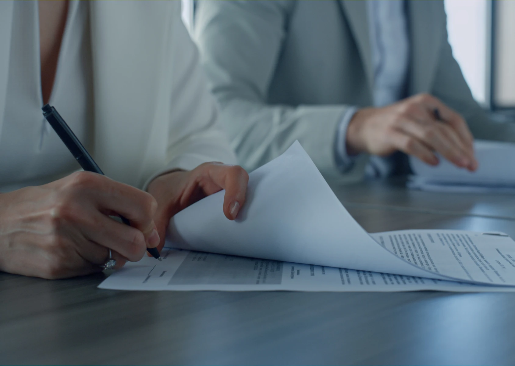 Business meeting paperwork signing